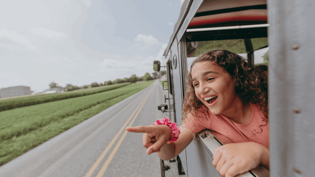 Kid seeing Amish farms on a Buggy Ride at Aaron & Jessica Buggy Rides Photo Credit Discover Lancaster